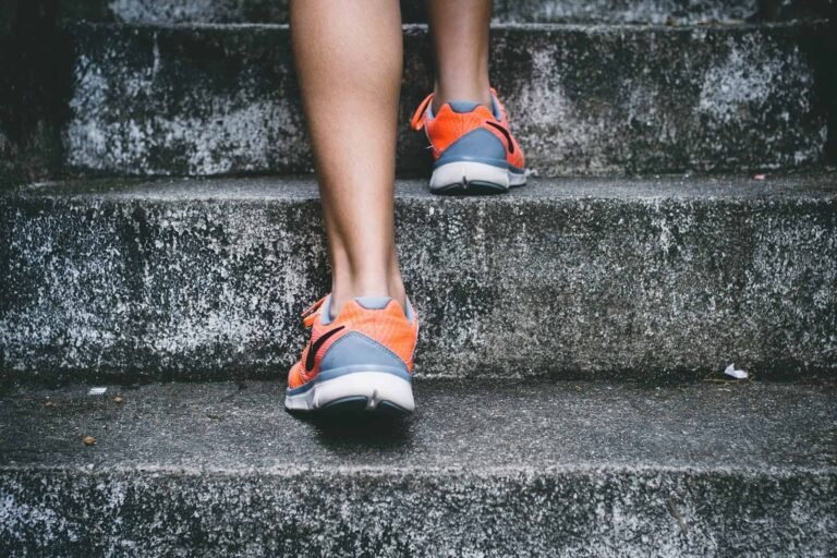 a running trainer going up stairs