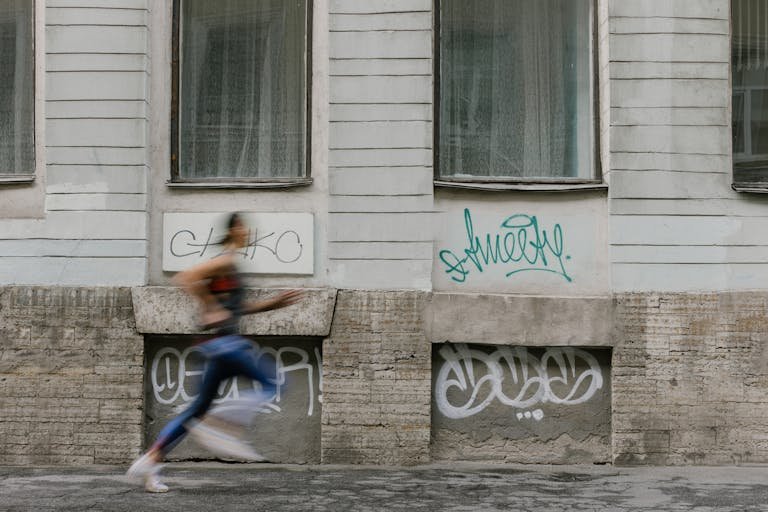 A Woman Jogging with blurred image to support mistakes runners make